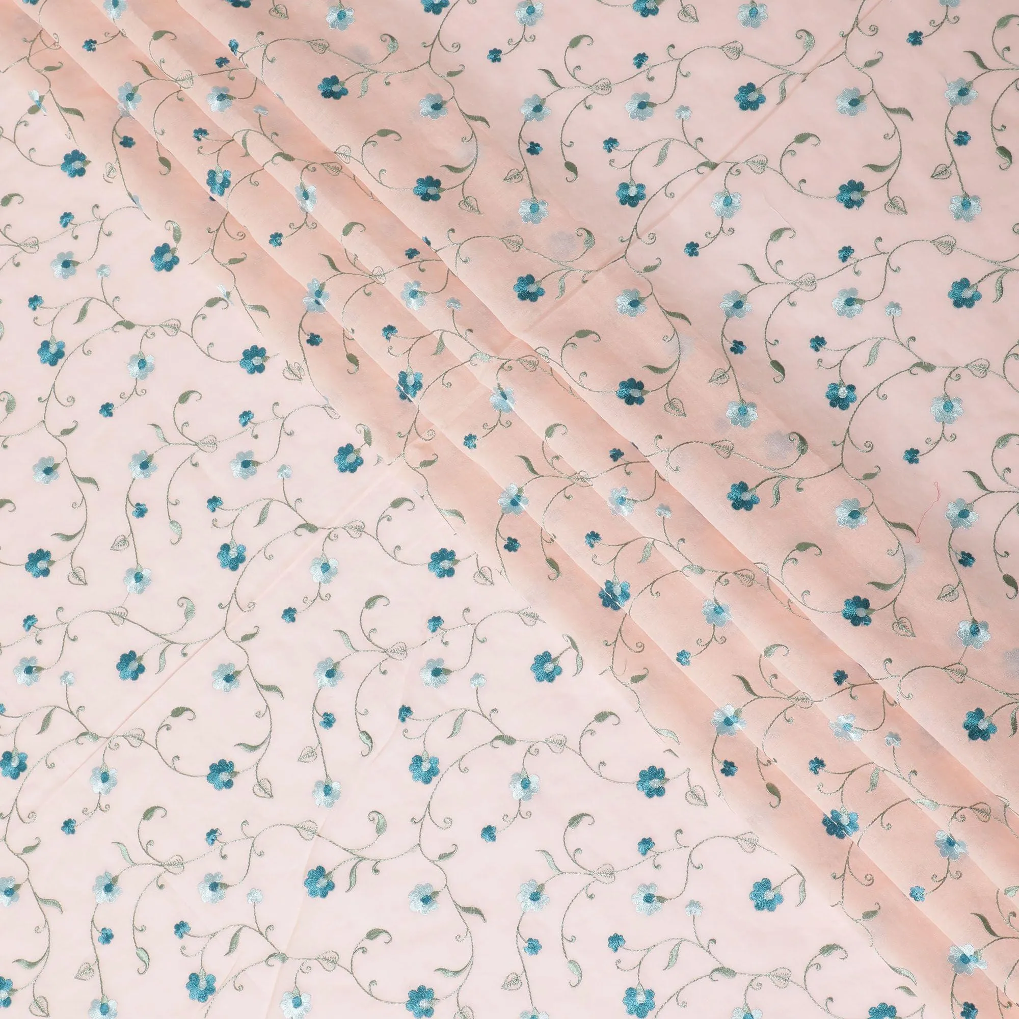 Peach cotton voile fabric with sapphire blue, olive green and powder blue embroidery in floral design-D11083