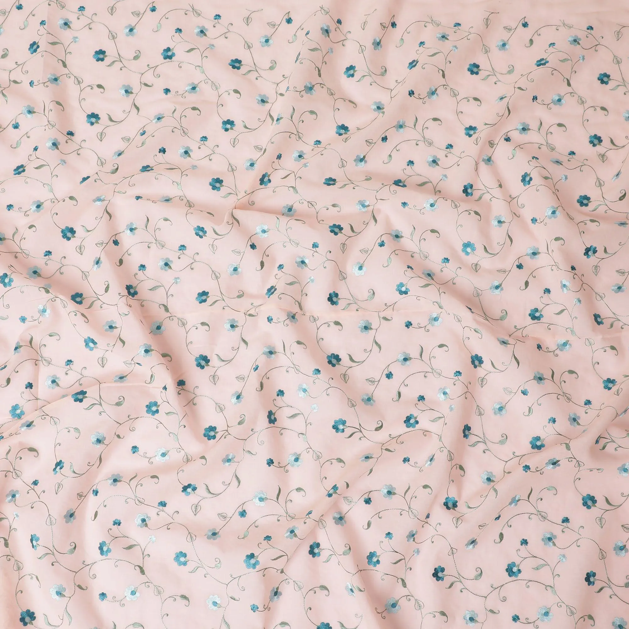 Peach cotton voile fabric with sapphire blue, olive green and powder blue embroidery in floral design-D11083